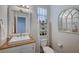 Clean bathroom with updated vanity, mirror and shelving at 5694 Colbert St, North Las Vegas, NV 89081