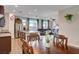Kitchen and dining area with hardwood floors and island at 5694 Colbert St, North Las Vegas, NV 89081