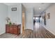 Bright and spacious entryway with wood-look floors and powder room at 5694 Colbert St, North Las Vegas, NV 89081