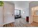 Entryway with a half bath and view into living room at 5694 Colbert St, North Las Vegas, NV 89081