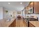 Eat-in kitchen with stainless steel appliances and granite countertops at 5694 Colbert St, North Las Vegas, NV 89081
