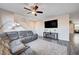 Spacious living room featuring a sectional sofa and fireplace at 5694 Colbert St, North Las Vegas, NV 89081