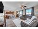 Open concept living room with kitchen and staircase views at 5694 Colbert St, North Las Vegas, NV 89081