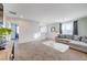 Open loft area featuring a gray couch and access to bedrooms at 5694 Colbert St, North Las Vegas, NV 89081