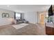 Bright and airy loft with gray sectional sofa and access to bathroom at 5694 Colbert St, North Las Vegas, NV 89081