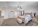 Bright and spacious main bedroom with a large bed and barn door at 5694 Colbert St, North Las Vegas, NV 89081