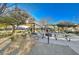 Community playground with shaded areas and play equipment at 5694 Colbert St, North Las Vegas, NV 89081