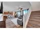 Modern staircase with open risers and carpet runner at 5694 Colbert St, North Las Vegas, NV 89081