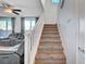 Modern staircase with carpeting and white railing, leading to upper level at 5694 Colbert St, North Las Vegas, NV 89081