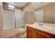 Clean bathroom with shower-tub, tile floor, vanity, and mirror at 5855 Valley Dr # 2045, North Las Vegas, NV 89031