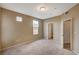 Carpeted bedroom featuring windows, a door, and neutral walls at 5855 Valley Dr # 2045, North Las Vegas, NV 89031