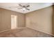 Spacious bedroom with neutral walls, carpet flooring, and a ceiling fan at 5855 Valley Dr # 2045, North Las Vegas, NV 89031