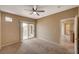 Carpeted bedroom featuring a sliding glass door to a balcony at 5855 Valley Dr # 2045, North Las Vegas, NV 89031