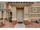 A front entrance to the home showing the front door, walkway, and some landscaping at 5855 Valley Dr # 2045, North Las Vegas, NV 89031