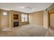 Inviting living room with fireplace, neutral carpet, and natural light at 5855 Valley Dr # 2045, North Las Vegas, NV 89031