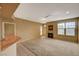 Inviting living room features a cozy fireplace and bright natural light from a large window at 5855 Valley Dr # 2045, North Las Vegas, NV 89031