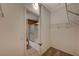 Walk-in closet with wire shelving leading to an adjacent bathroom with a shower/tub combo at 5855 Valley Dr # 2045, North Las Vegas, NV 89031