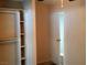 Bedroom with a white closet and door to another room at 6681 Bubbling Brook Dr # A, Las Vegas, NV 89107
