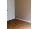 Bedroom with light brown laminate flooring and white closet doors at 6681 Bubbling Brook Dr # A, Las Vegas, NV 89107