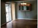 Dining area with hardwood floors and sliding glass door at 6681 Bubbling Brook Dr # A, Las Vegas, NV 89107
