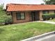 Tan house with tile roof, landscaping, and walkway at 6681 Bubbling Brook Dr # A, Las Vegas, NV 89107