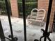 Private patio with a white metal bench at 6681 Bubbling Brook Dr # A, Las Vegas, NV 89107