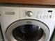 White Frigidaire front-load washer with digital controls at 6681 Bubbling Brook Dr # A, Las Vegas, NV 89107