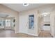 Light and airy entryway with wood-look floors and white door at 7457 Painted Shadows Way, Las Vegas, NV 89149