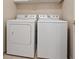 Convenient laundry room with full-size washer and dryer at 7457 Painted Shadows Way, Las Vegas, NV 89149