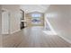 Living room with vaulted ceiling, fireplace and wood-look floors at 7457 Painted Shadows Way, Las Vegas, NV 89149