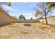 Backyard view showcasing a firepit and open space at 7513 Powder River Ct, Las Vegas, NV 89131