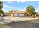 House exterior with three-car garage and driveway at 7513 Powder River Ct, Las Vegas, NV 89131