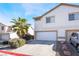 Two story home with attached garage and landscaping at 774 Peregrine Falcon St, Henderson, NV 89015