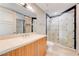 Modern bathroom with a large glass shower and vanity at 9101 Alta Dr # 502, Las Vegas, NV 89145