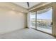Spacious bedroom with sliding door to balcony and mountain views at 9101 Alta Dr # 502, Las Vegas, NV 89145