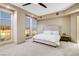 Main bedroom with city views and plush upholstered bed at 9101 Alta Dr # 502, Las Vegas, NV 89145