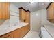 Laundry room with ample cabinetry, sink, and washer/dryer hookups at 9101 Alta Dr # 502, Las Vegas, NV 89145