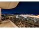 Night view from balcony showcasing city lights and mountain backdrop at 9101 Alta Dr # 502, Las Vegas, NV 89145