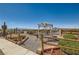 Landscaped backyard with desert flora and a gazebo, offering stunning views of the distant city and mountains at 919 Havre Ave, Henderson, NV 89015
