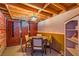 Finished basement features a sitting area, wooden ceiling beams and custom wood cabinets at 919 Havre Ave, Henderson, NV 89015