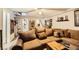 Relaxing basement with sectional sofa, spiral staircase, and decorative accents at 919 Havre Ave, Henderson, NV 89015