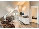 Sitting room with chairs, desk, tv, and access to adjacent bedroom with comfortable decor at 919 Havre Ave, Henderson, NV 89015