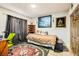 Cozy bedroom with double bed, wood dresser, and decorative wall art at 919 Havre Ave, Henderson, NV 89015