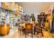 Bright dining area with a glass table, leather chairs, and kitchen view at 919 Havre Ave, Henderson, NV 89015