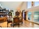 Spacious dining room features a glass-top table, leather chairs, and hardwood floors at 919 Havre Ave, Henderson, NV 89015