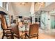 Spacious dining room with large table, chairs, and fireplace, perfect for gatherings and entertaining guests at 919 Havre Ave, Henderson, NV 89015