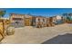 Rustic building exterior featuring stone accents, wood planks, barrels, and ample parking space at 919 Havre Ave, Henderson, NV 89015