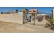 Unique gated property featuring castle-like exterior design with wrought iron gate at 919 Havre Ave, Henderson, NV 89015
