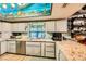 Kitchen boasts granite countertops, stainless steel appliances, and a painted ceiling at 919 Havre Ave, Henderson, NV 89015