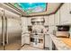 Modern kitchen with stainless steel appliances, granite countertops, and ample cabinet space for cooking convenience at 919 Havre Ave, Henderson, NV 89015